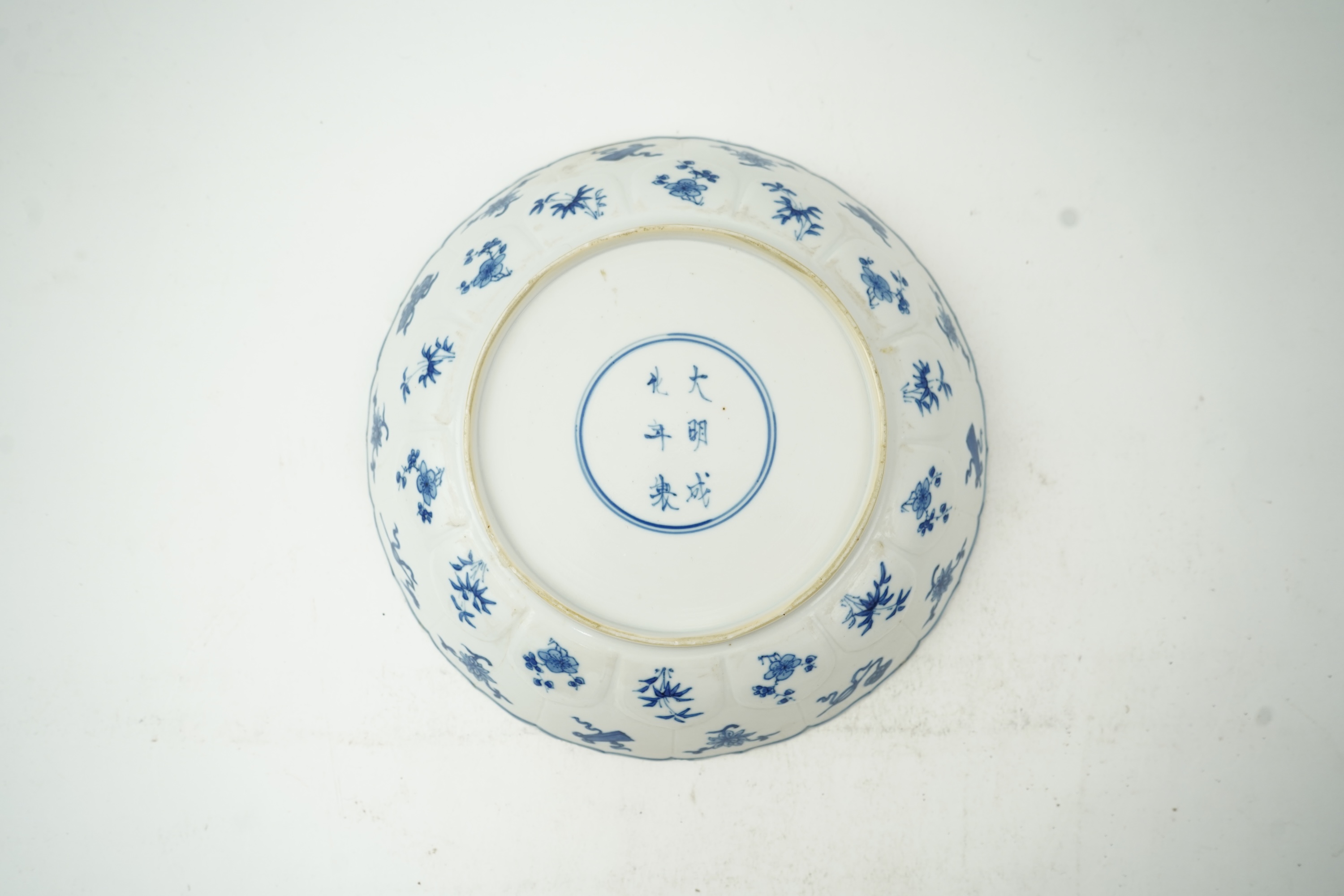 A Chinese blue and white ‘ladies and phoenix’ dish, Kangxi period